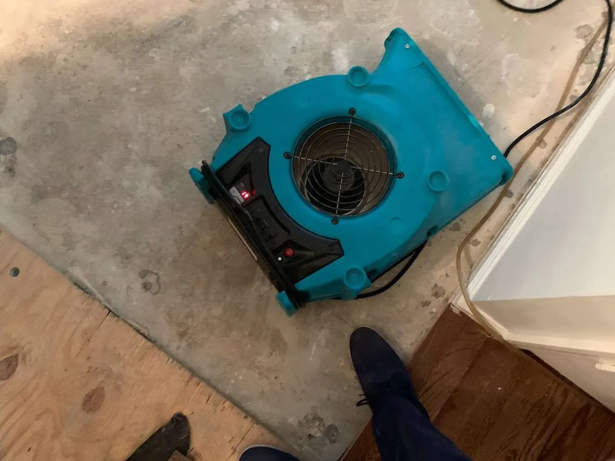 Air mover drying subfloor during Commercial Water Damage Restoration in Odessa